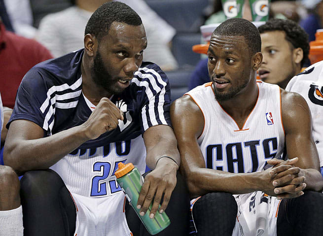 Guard Kemba Walker (right) recruited Al Jefferson to Charlotte to help guide the young Bobcats.